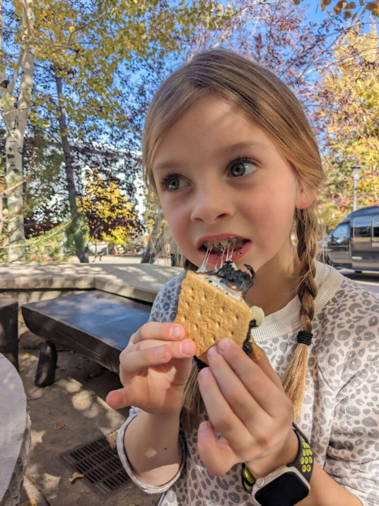 child eating s'mores